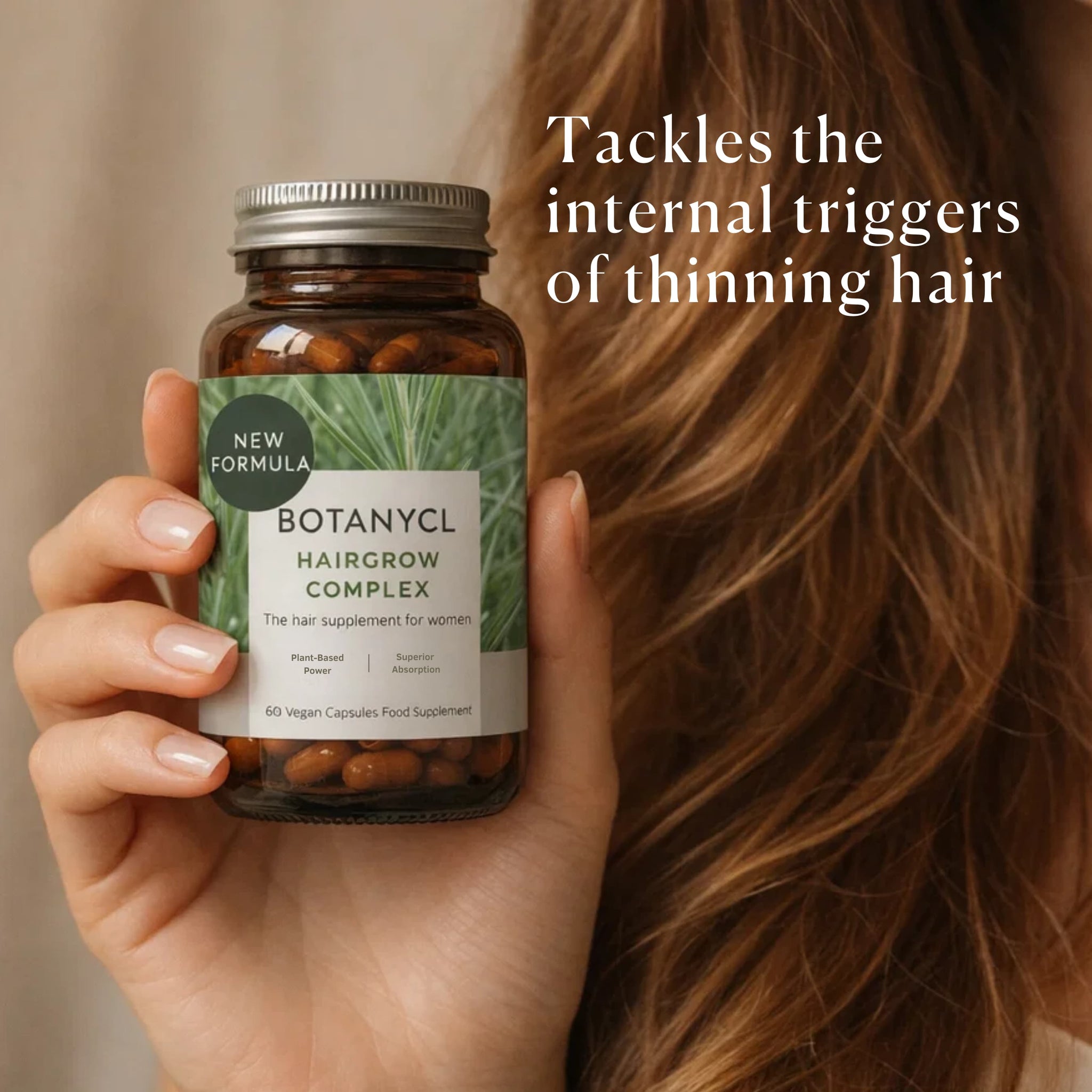 Hand holding a bottle of Botanycl Hairgrow Complex with text about tackling internal triggers of thinning hair.